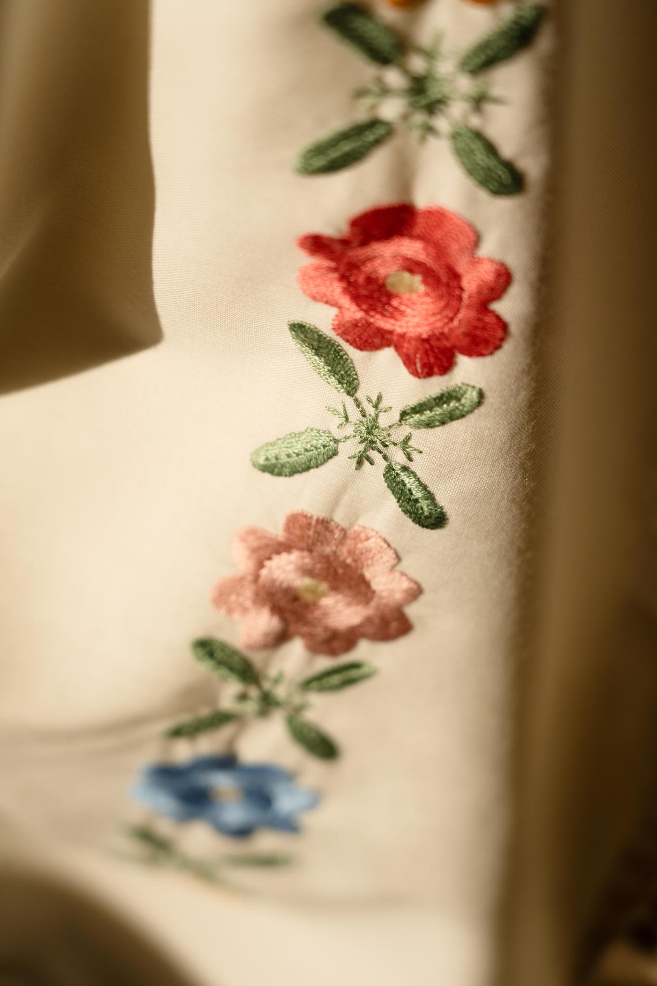 close-up of detailed floral embroidery on linen